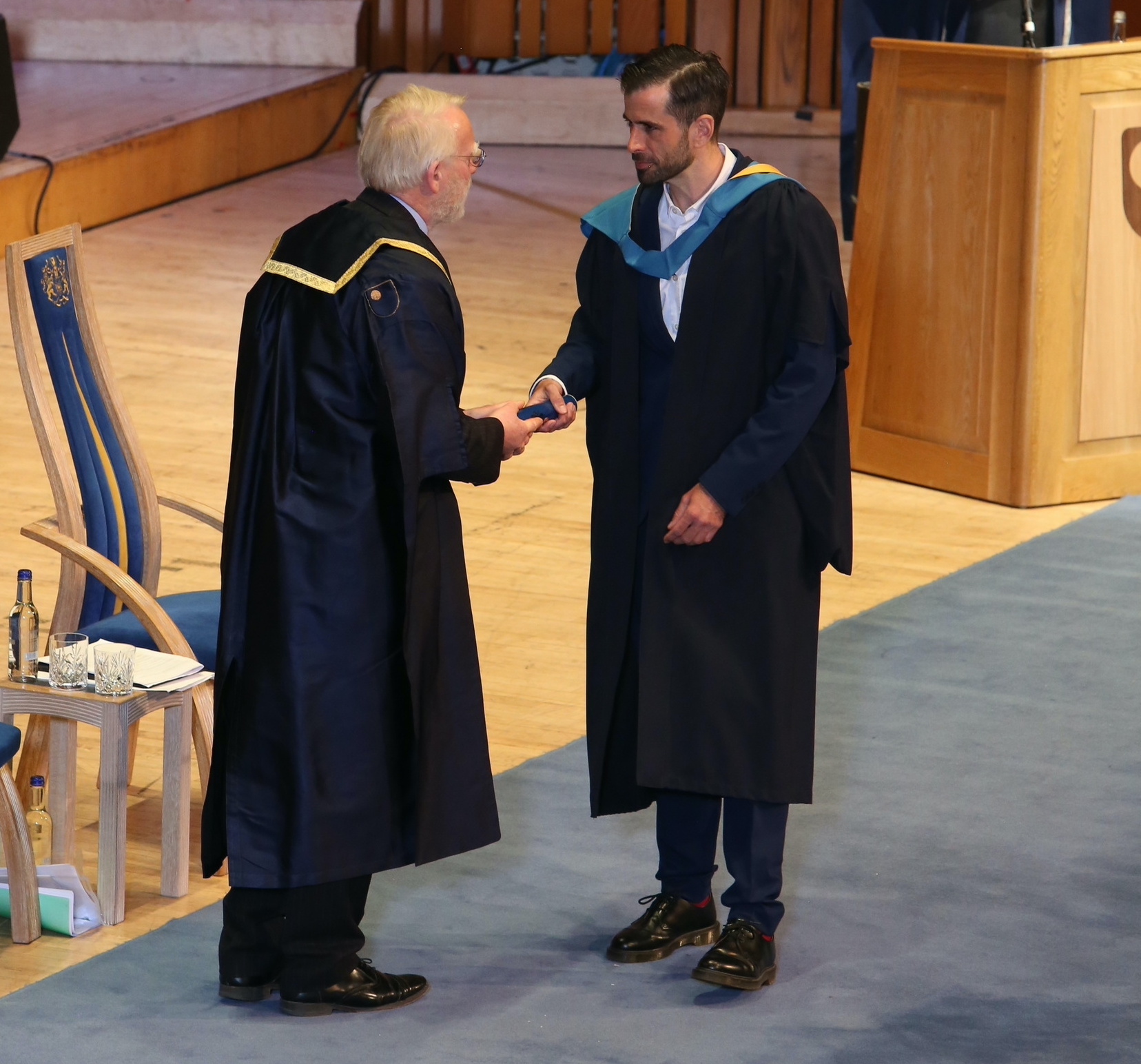 Receiving undergraduate degree from The Open University